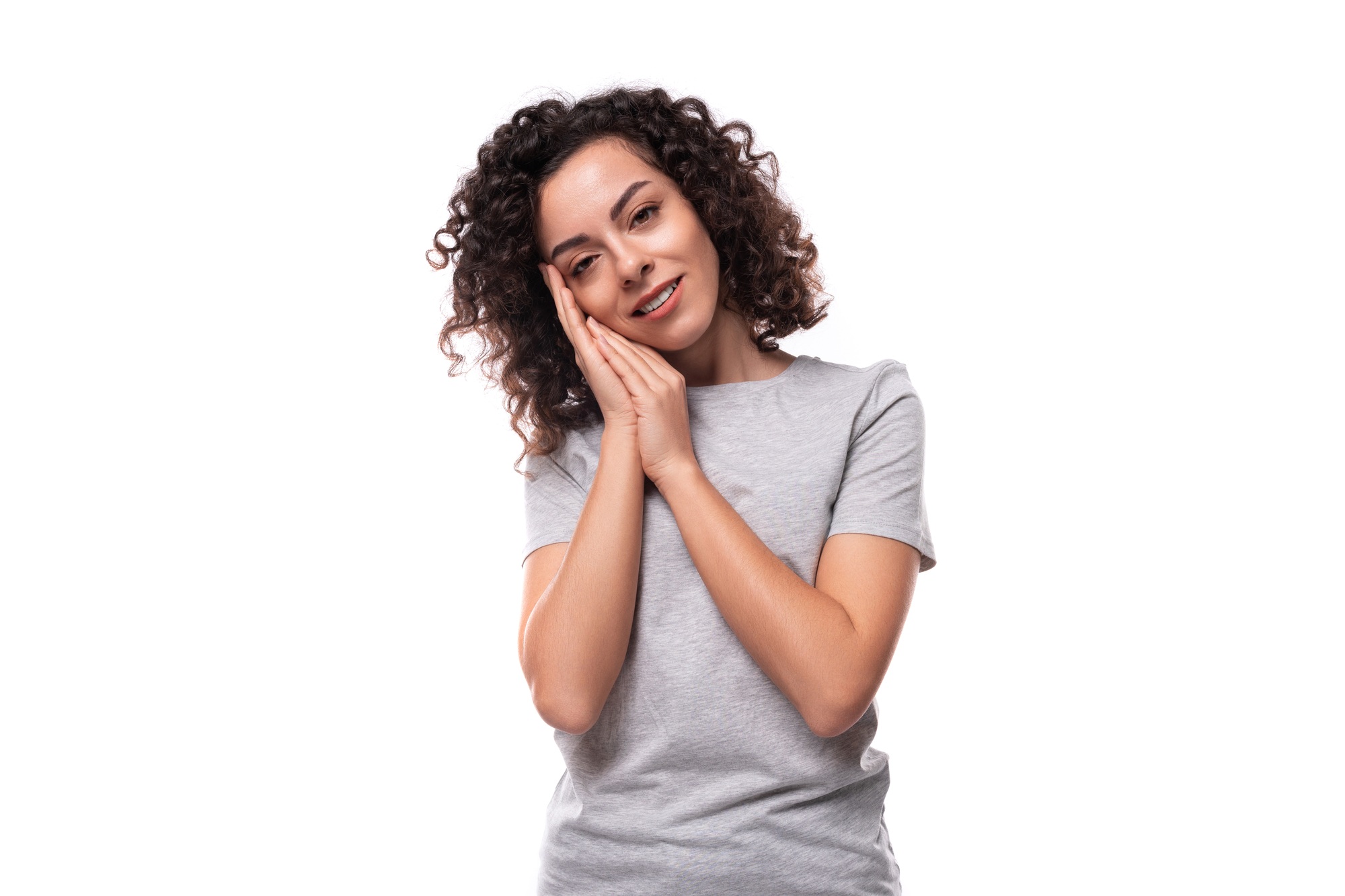 young charming curly woman dressed in a gray basic t-shirt for branding print